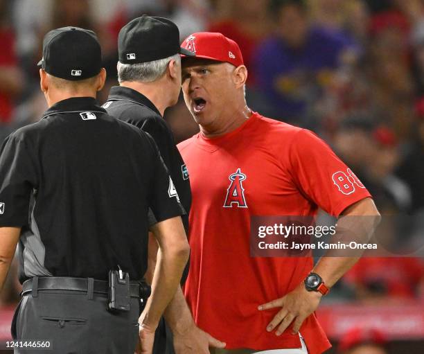 Interim manager Phil Nevin of the Los Angeles Angels argues with umpire Bill Welke after he was ejected in the seventh inning of the game against the...