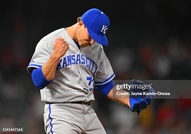 Daniel Mengden of the Kansas City Royals celebrates after earning a save in the 11th inning of the game against the Los Angeles Angels at Angel...