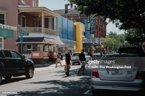 People walk in the main business area of Doylestown, PA., on Monday June 20 2022.