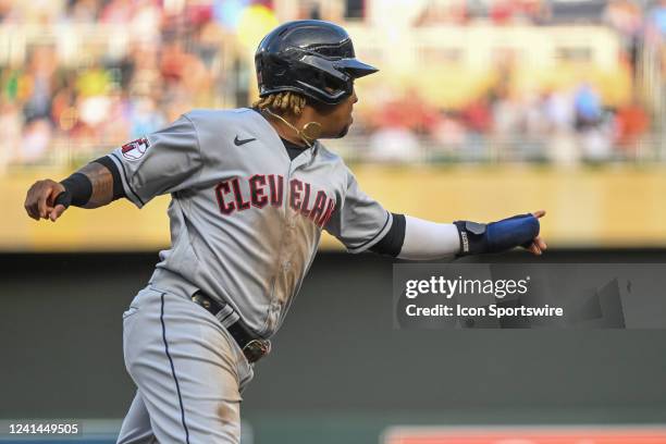 Cleveland Guardians infielder Jose Ramirez points at Cleveland Guardians infielder Josh Naylor as he rounds third and heads for home on the home run...
