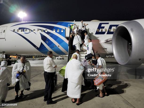 Palestinian pilgrims wearing Ihram clothes boarding plane to Saudi Arabia at Cairo Airport in Egypt on June 22, 2022. Palestinians crossed Rafah...