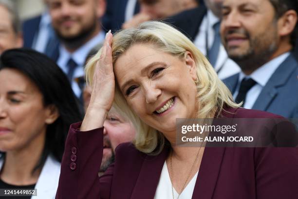 French far-right Rassemblement National leader and Member of Parliament Marine Le Pen arrives for a family picture with Members of Parliament at the...