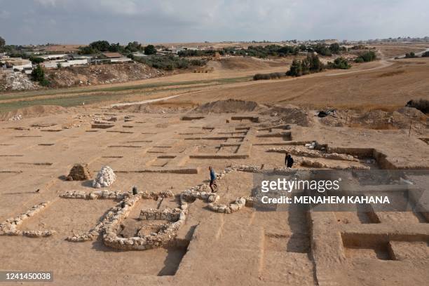 An aerial view shows Palestinian workers of Israel's Antiquities Authority during work at a recently discovered ancient mosque, which dates back to...