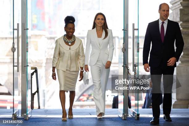 Prince William, Duke of Cambridge and Catherine, Duchess of Cambridge accompanied by Baroness Floella Benjamin attend the unveiling of the National...