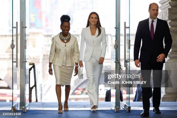 Britain's Prince William , Duke of Cambridge, and Catherine, Duchess of Cambridge, accompanied by Baroness Floella Benjamin arrive to attend the...