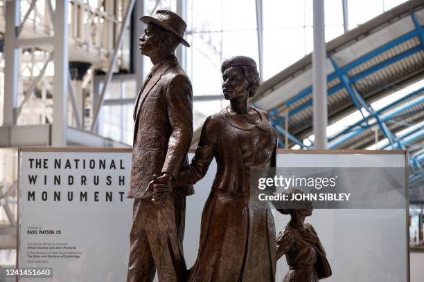 The National Windrush Monument created by Jamaican artist Basil Watson is unveiled at Waterloo Station in London on June 22, 2022. - RESTRICTED TO...