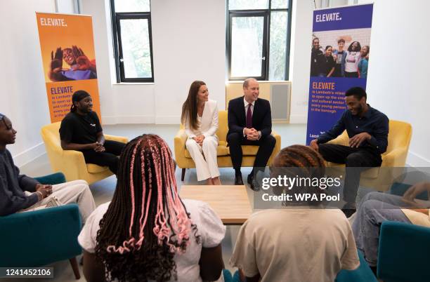 Prince William, Duke of Cambridge and Catherine, Duchess of Cambridge speak with participants during a visit to the ELEVATE initiative at Brixton...