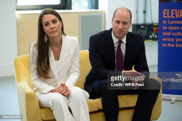 Prince William, Duke of Cambridge and Catherine, Duchess of Cambridge speak with participants during a visit to the ELEVATE initiative at Brixton...
