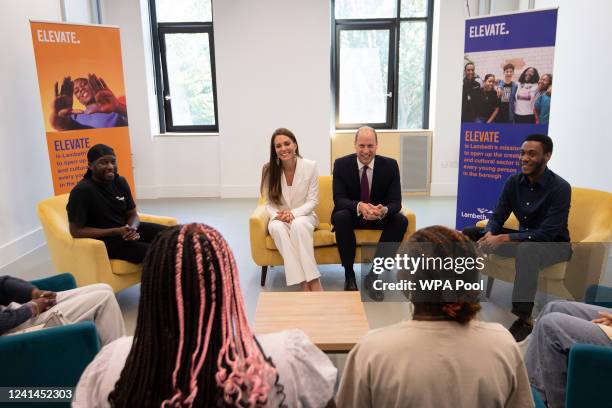 Prince William, Duke of Cambridge and Catherine, Duchess of Cambridge speak with participants during a visit to the ELEVATE initiative at Brixton...