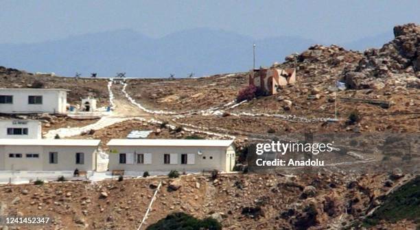 Photo taken from Mugla province shows militarization on Greek island of Pserimos on June 12 Turkiye. A helicopter pad, prefabricated buildings,...