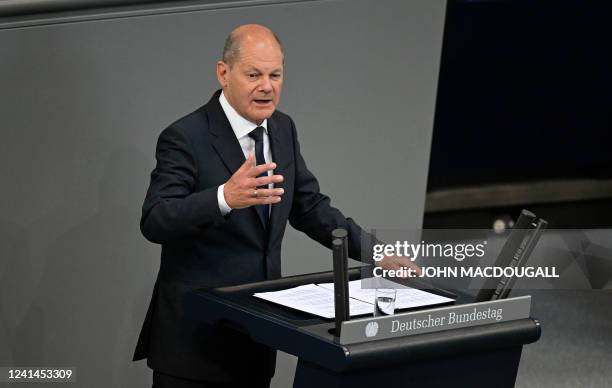 German Chancellor Olaf Scholz addresses the Bundestag in Berlin on June 22 before a EU summit, a G7 summit and a Nato summit.