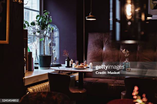 breakfast on table in restaurant - hanging lamp stock pictures, royalty-free photos & images