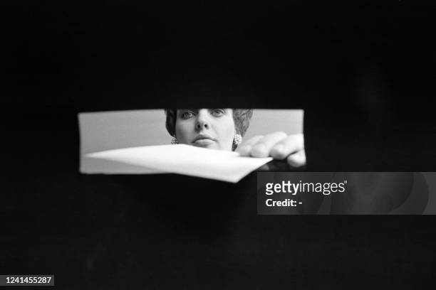 Young woman slips her ballot into a ballot box in a polling station on May 05, 1974 in Paris for the first round of the 1974 French presidential...