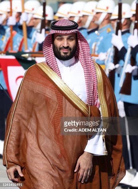 Crown Prince of Saudi Arabia Mohammed bin Salman reviews the honour guard as he is welcomed by Turkey's President during an official ceremony at the...