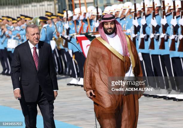 Turkey's President Recep Tayyip Erdogan reviews the honour guard as he welcomes Crown Prince of Saudi Arabia Mohammed bin Salman during an official...