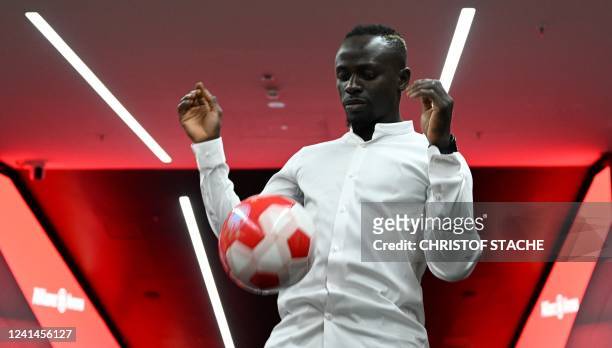 Bayern Munich's Senegalese new forward Sadio Mane plays the ball during a press conference after he signed a three-year deal with German first...
