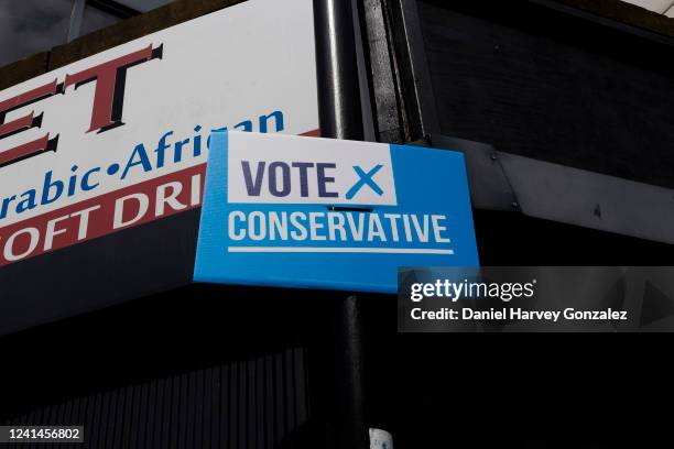 Placard campaigning for support of the Conservative Party candidate as voters in the former Red Wall constituency prepare to cast their ballots in...