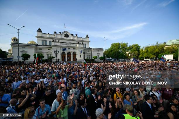 People take part in a demonstration in support of the government, after a successful no-confidence vote in front of the Bulgarian Parliament in Sofia...