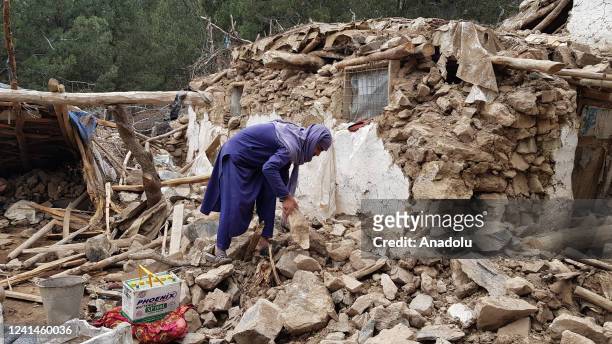 Man searches for his belongings under debris after a magnitude 7.0 earthquake shook Afghanistan at noon and killed at least 29 people, and injured 62...
