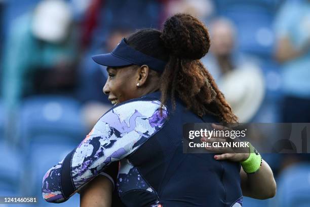 Serena Williams of the US and Tunisia's Ons Jabeur celebrate after winning against Japan's Shuko Aoyama and Taiwan's Chan Hao-ching at the end of...