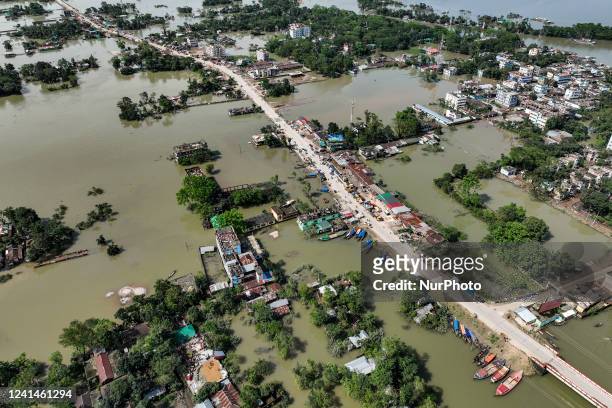 An aerial view of houses submerged by water after flash floods at companiganj sub-district in Sylhet, Bangladesh on June 22, 2022.