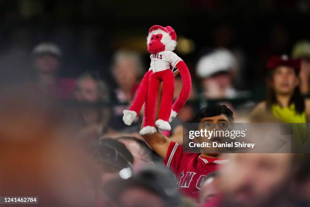 Fan waves a rally monkey during the game between the Kansas City Royals and the Los Angeles Angels at Angel Stadium on Tuesday, June 21, 2022 in...