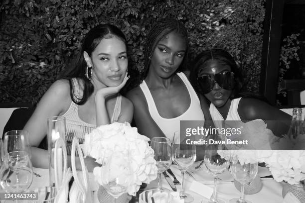 Aleali May, Leomie Anderson and Bree Runway attend the Holzweiler dinner during Paris Fashion Week at La Societe on June 22, 2022 in Paris, France.