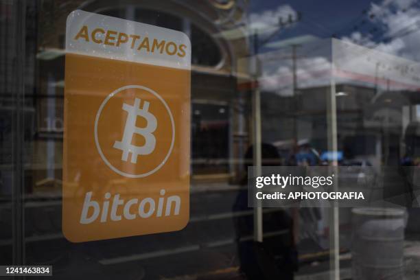 View of a Bitcoin sign announcing the acceptance of the crypto for payments at the San Salvador Historical Center on June 22, 2022 in San Salvador,...