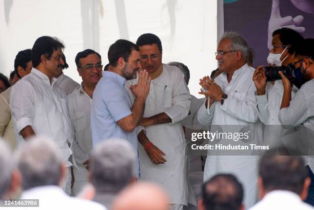 Congress leader Rahul Gandhi gestures at Chhattisgarh Chief Minister Bhupesh Baghel upon arrival for a 'Satyagrah' against the 'Agnipath' scheme, at...