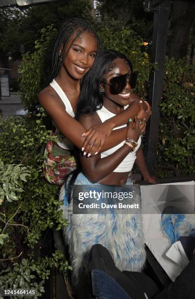 Leomie Anderson and Bree Runway attend the Holzweiler dinner during Paris Fashion Week at La Societe on June 22, 2022 in Paris, France.