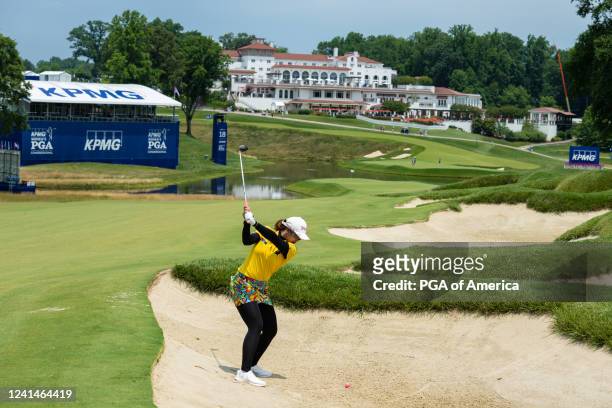 Pomanong Phatlum of Thailand hits out of a bunker on the 18th hole during a practice round for the 2022 KPMG Women's PGA Championship at...