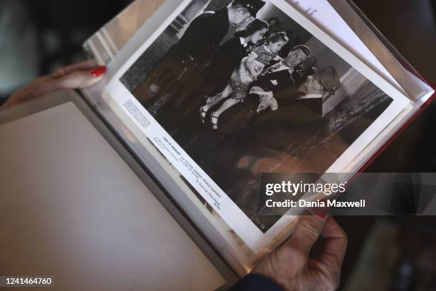 Barbara Wright Isaac thumbs through a scrapbook of showbiz movie stills of sister Lora Lee Michel at her daughters home home on Tuesday, March 1,...