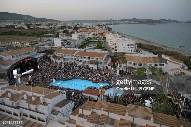 People party at the Ushuaia nightclub in Ibiza, on June 17, 2022. - After being closed for two years because of the Covid-19 pandemic, the...