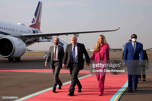 British Prime Minister Boris Johnson and his wife Carrie Johnson disembark from their plane as they arrive for the Commonwealth Heads of Government...