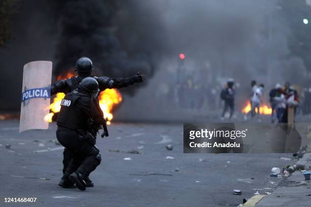 Riot police interfere with tear gas during the protest at the El Ejido park on the tenth consecutive day of protests against the government in Quito,...