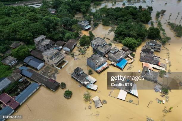 This aerial photo taken on June 23, 2022 shows a flooded area after heavy rains in Yingde, Qingyuan city, in China's southern Guangdong province. /...