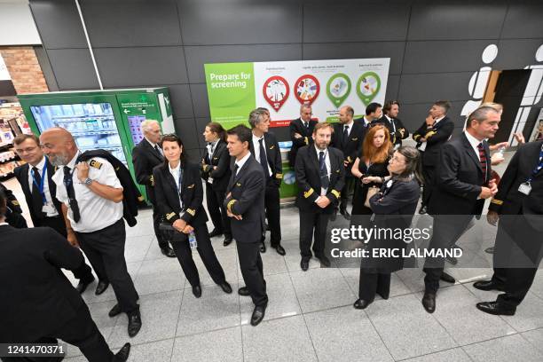 Illustration shows workers on strike in the departure hall of Brussels Airport, in Zaventem, Thursday 23 June 2022. Pilots and cabin crew members of...