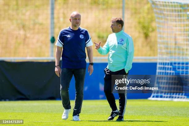 Sporting director Rouven Schroeder of FC Schalke 04 talks to head coach Frank Kramer of FC Schalke 04 after the FC Schalke 04 - Training Session on...