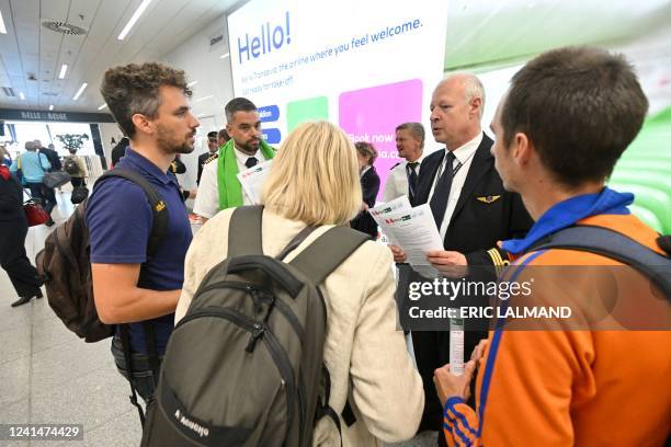 Illustration shows workers on strike and travelers in the departure hall of Brussels Airport, in Zaventem, Thursday 23 June 2022. Pilots and cabin...