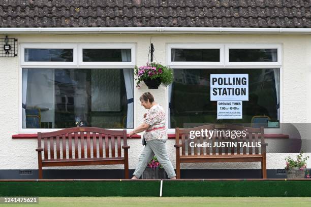 Voter leaves a polling station in Seaton in East Devon in southwest England as Tiverton and Honiton held a by-election on June 23, 2022. - Britain's...