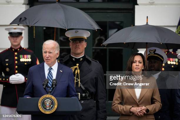 President Joe Biden speaks as Vice President Kamala Harris looks on during an event with members of the Wounded Warrior Project's Soldier Ride, on...