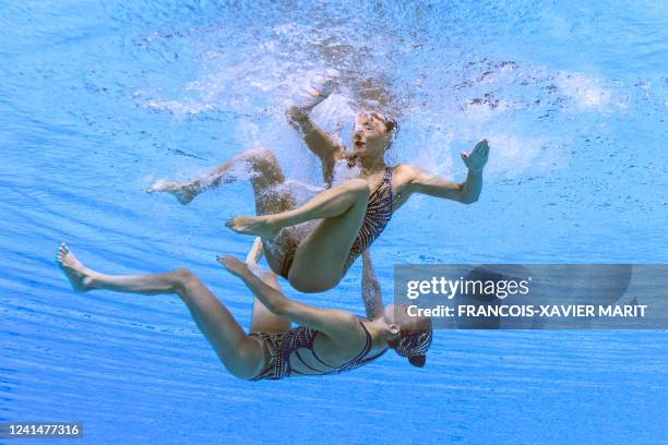 Netherland's Bergje de Brouwer and Netherland's Marloes Steenbeek compete in the women's duet free artistic swimming finals during the Budapest 2022...