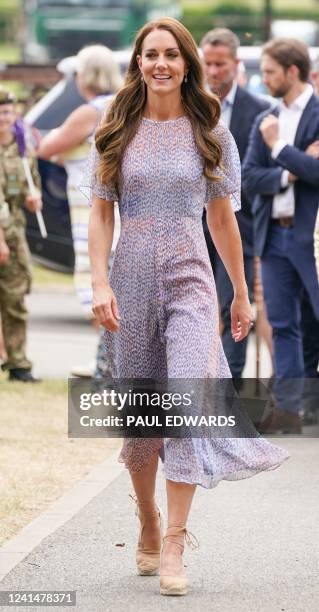 Britain's Catherine, Duchess of Cambridge smiles as she visits Cambridgeshire County Day at Newmarket Racecourse on June 23, 2022. Comprising of 120...
