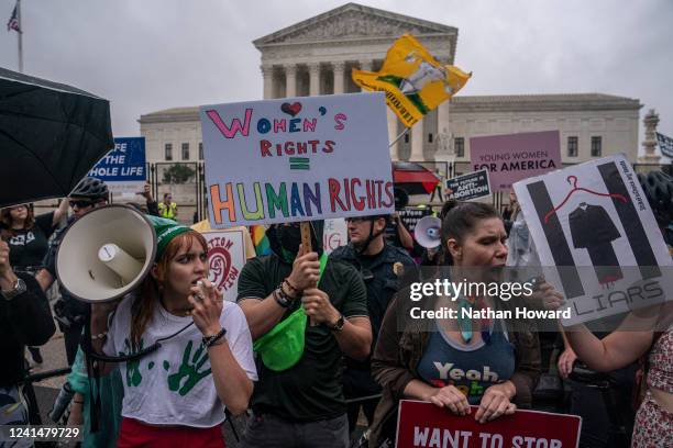 Abortion-rights activists chant during a rally in front of the Supreme Court on June 23, 2022 in Washington, DC. The court announced a...