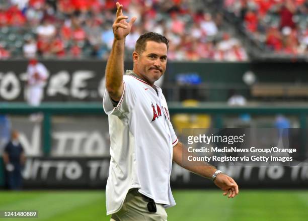 Anaheim, CA Troy Glaus waves to the crowd during a pregame ceremony celebrating the 20th anniversary of their 2002 World Series team at Angel Stadium...