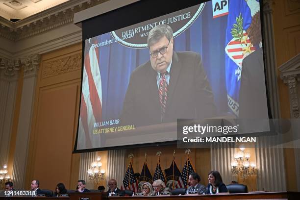 Video of former Attorney General William Barr speaking is shown on a screen during the fifth hearing by the House Select Committee to Investigate the...