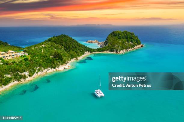 beautiful turquoise bay in lakka at sunset. paxos. ionian islands of greece. - ionian islands stock-fotos und bilder