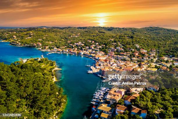 gaios, capital city of paxos island at sunset, aerial view. greece - greece city photos et images de collection