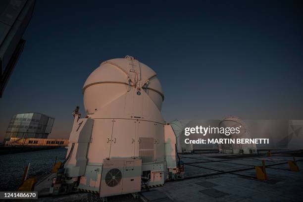 Picture taken at sunset at the platform of the Very Large Telescope , with its four optical telescopes and four movable auxiliary telescopes, at the...