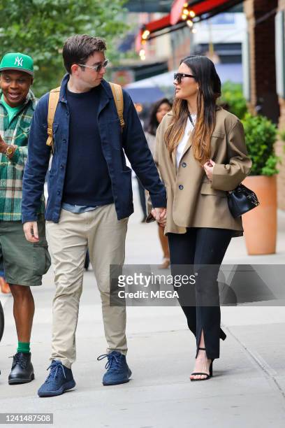 Olivia Munn and John Mulaney are seen holding hands on June 23, 2022 in New York, New York.